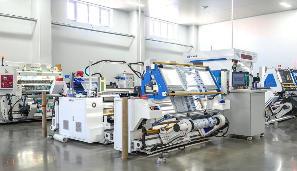 Flexible pouch printing and laminating production machines in workshop